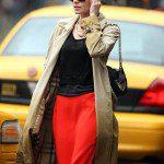 kate bosworth candid photo casual cool outfit- long red skirt- black top- burberry trench coat- black chain purse- black wayfarer sunglasses-simple style makeup